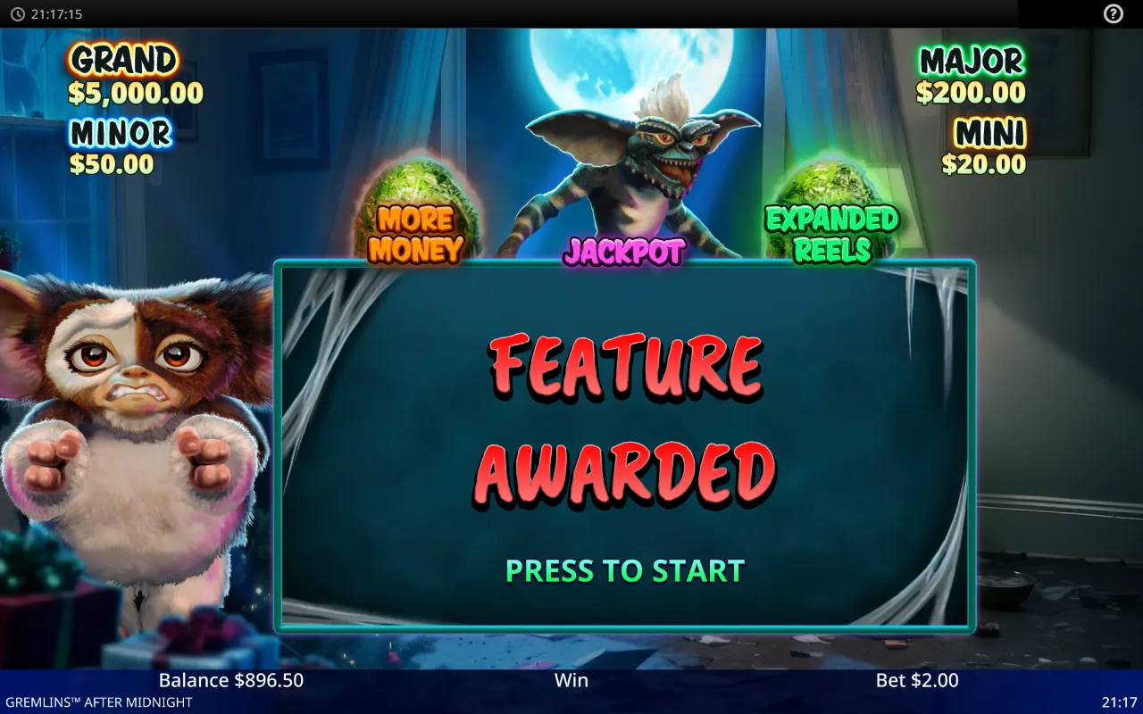 FEATURE AWARDED screen with a Gremlin hatched above the JACKPOT egg and the balance at $896.50