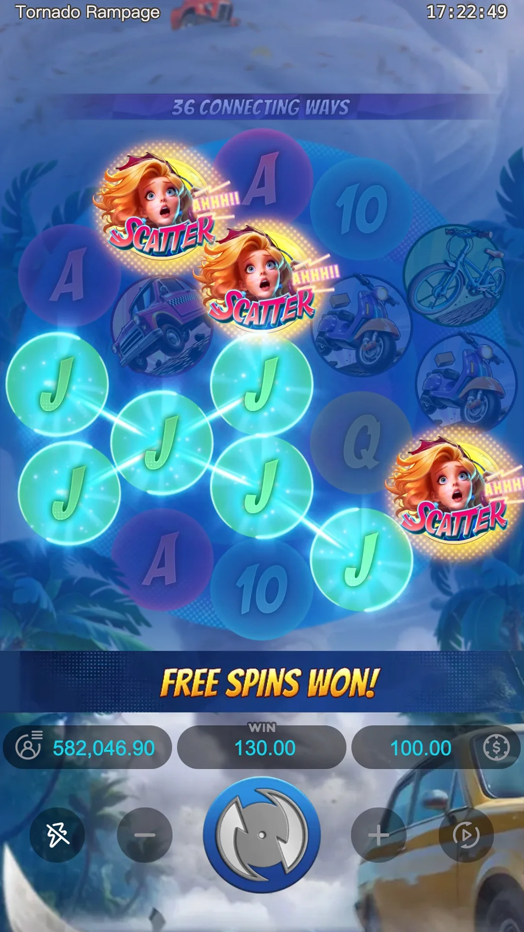 Three Scatter symbols and a chain of six glowing J symbols on the Tornado Rampage grid, with FREE SPINS WON banner